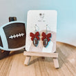 Load image into Gallery viewer, Bow with Nested Football Earrings