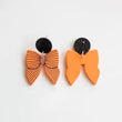 Load image into Gallery viewer, Orange &amp; Black Acrylic Bows
